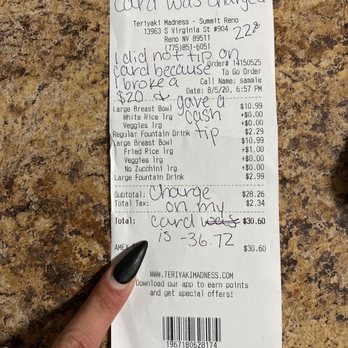 Teriyaki Madness - a hand holding a receipt - Japanese Near Me - Reno, Nevada Teriyaki Madness - a hand holding a receipt - Japanese Near Me - Reno, Nevada