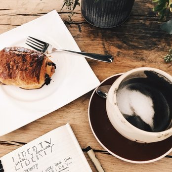 Dom's Coffee - Chocolate Croissant and Mocha Charcoal Latte w/ Coconut milk - Coffee & Tea Near Me - Avon, Connecticut