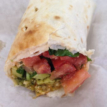 Tropical Smoothie Cafe - Half of the spinach feta omelet wrap - Sandwiches Near Me - Frederick, Maryland Tropical Smoothie Cafe - Half of the spinach feta omelet wrap - Sandwiches Near Me - Frederick, Maryland