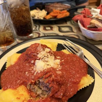 Zottola's Pub & Eatery - Homemade stuffed cheese ravioli with their traditional homemade sauce with meatballs. Steak potatoes and carrots in back ground. - New American Near Me - Tarentum, Pennsylvania Zottola's Pub & Eatery - Homemade stuffed cheese ravioli with their traditional homemade sauce with meatballs. Steak potatoes and carrots in back ground. - New American Near Me - Tarentum, Pennsylvania