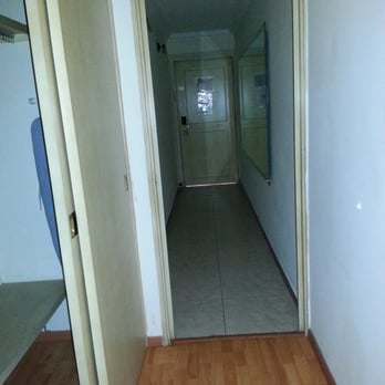 Posada del Marques - Hallway which has a big wall mirror. Closet, shelves, ironing board & iron, hangers and a safe. - Guadalajara, JAL Posada del Marques - Hallway which has a big wall mirror. Closet, shelves, ironing board & iron, hangers and a safe. - Guadalajara, JAL