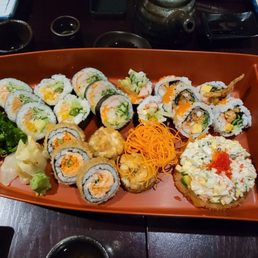 a platter of sushi and rolls a platter of sushi and rolls