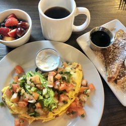 The Butter House - Cali style omelette topped with fresh pico de Gallo and add sour cream. With fruit and one piece of French toast.
