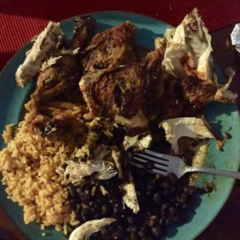 Charo Chicken - Digging into a 4-piece with rice and black bean sides. - Mexican Near Me - Long Beach, California Charo Chicken - Digging into a 4-piece with rice and black bean sides. - Mexican Near Me - Long Beach, California