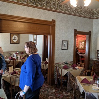 Steinbeck House Restaurant - The original living room, now restaurant seating. This photo was taken just before closing time, with the docent explaining the history. - American Near Me - Salinas, California