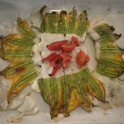 Antica Osteria Cavallini - Perfectly cooked branzino with zucchini blossoms.