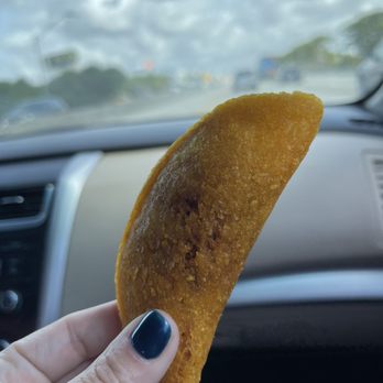 La Colina Restaurant - a hand holding a piece of food - Colombian Near Me - Hollywood, Florida La Colina Restaurant - a hand holding a piece of food - Colombian Near Me - Hollywood, Florida