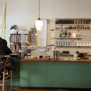 Sweedeedee - a woman sitting at a counter in a coffee shop - Breakfast & Brunch Near Me - Portland, Oregon