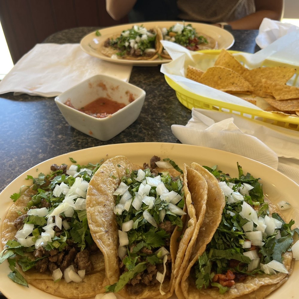 Steak tacos and one el pastor