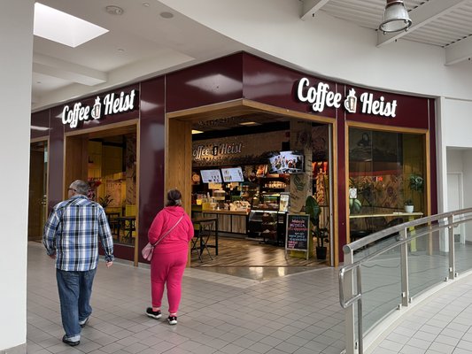 Photo of Coffee Heist - Santa Ana, CA, US. two people walking in front of a coffee shop