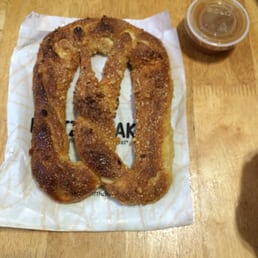 almond pretzel dipped in caramel sauce almond pretzel dipped in caramel sauce