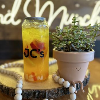 JC's Boba Tea And Munchies - a jar of iced tea and a potted plant - Bubble Tea Near Me - Jackson, Tennessee JC's Boba Tea And Munchies - a jar of iced tea and a potted plant - Bubble Tea Near Me - Jackson, Tennessee