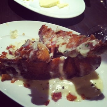 Jardenea - Crispy potato wedges with blue cheese sauce and bacon. Kind of like an amped up version of poutain fries! - New American Near Me - Washington, DC, District of Columbia