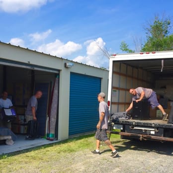 OB Moving - Four gentle, professional and good-natured gentlemen from OB Moving making short work of unpacking a storage unit and loading a moving truck - Movers Near Me - Freeville, New York