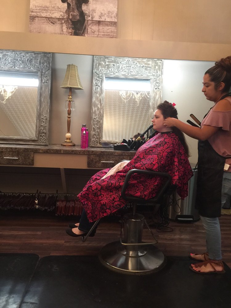 Attitudes Hair Salon & Boutique Logo