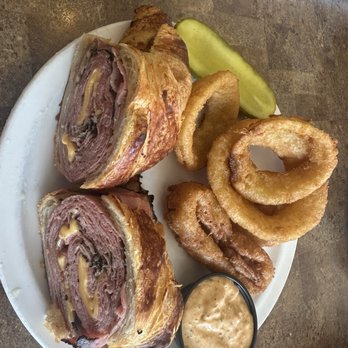 TooJay’s Deli * Bakery * Restaurant - Hot Pastrami on a croissant with onion rings - Delis Near Me - Lake Worth, Florida TooJay’s Deli * Bakery * Restaurant - Hot Pastrami on a croissant with onion rings - Delis Near Me - Lake Worth, Florida