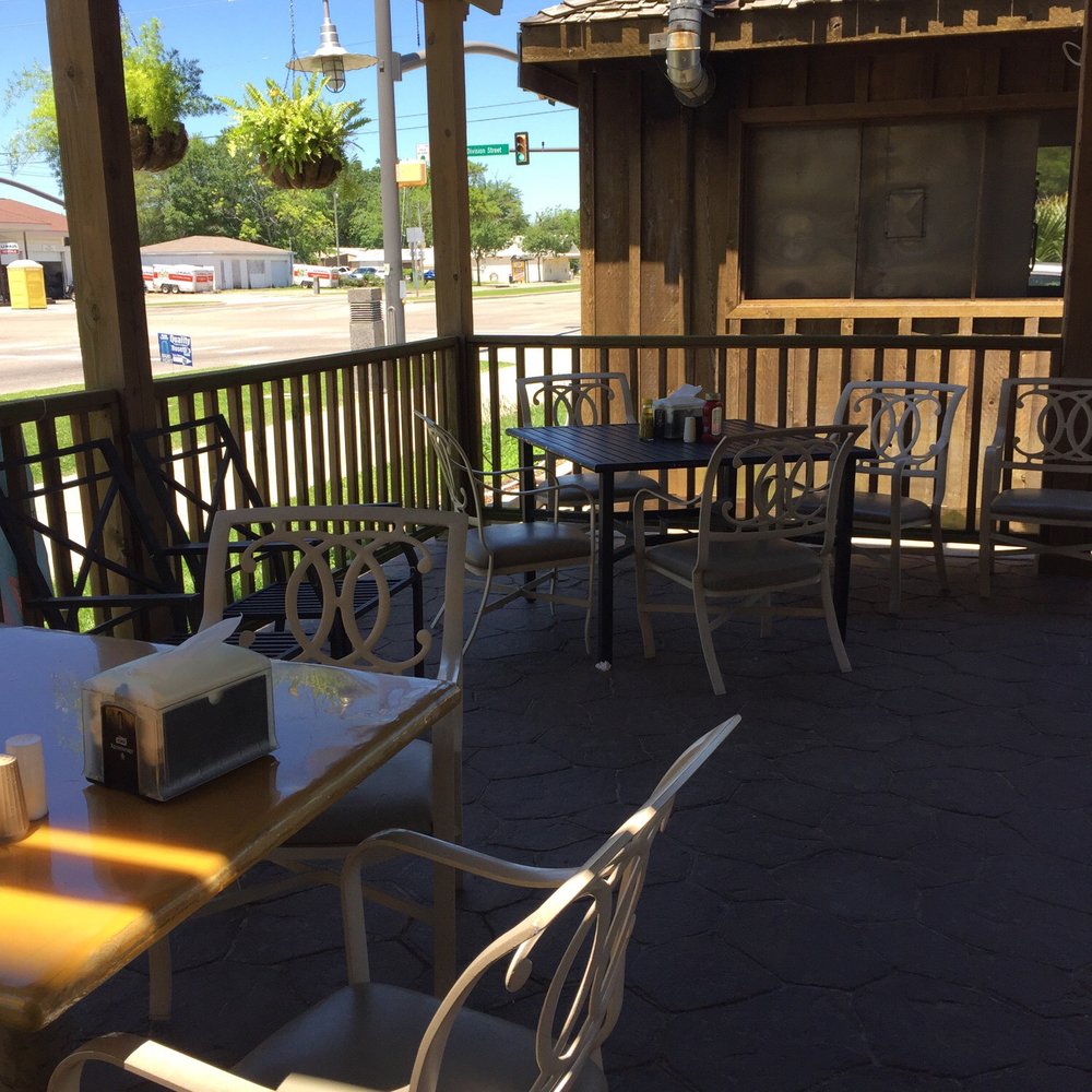 Rosetti's Cafe - a table and chairs on a covered patio - Seafood Near Me - Biloxi, Mississippi Rosetti's Cafe - a table and chairs on a covered patio - Seafood Near Me - Biloxi, Mississippi