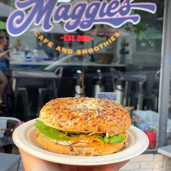 Maggie's Cafe and Smoothies - a hand holding a sandwich - Juice Bars & Smoothies Near Me - Safety Harbor, Florida Maggie's Cafe and Smoothies - a hand holding a sandwich - Juice Bars & Smoothies Near Me - Safety Harbor, Florida