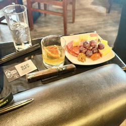 Best Cigar Pub - Manhattan Sour with a charcuterie dish and a cigar