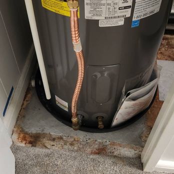 Kama'aina Handyman - Tile work was not completed, it was supposed to go around this water heater (the view from the other side) - Handyman Near Me