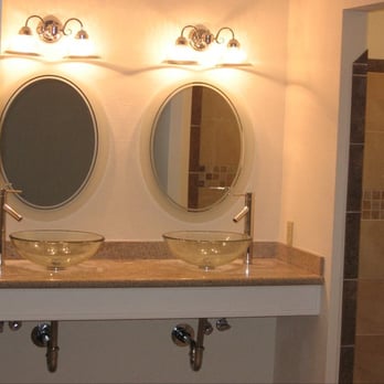 Wharton Construction - a bathroom with two sinks and a shower - General Contractors Near Me Wharton Construction - a bathroom with two sinks and a shower - General Contractors Near Me