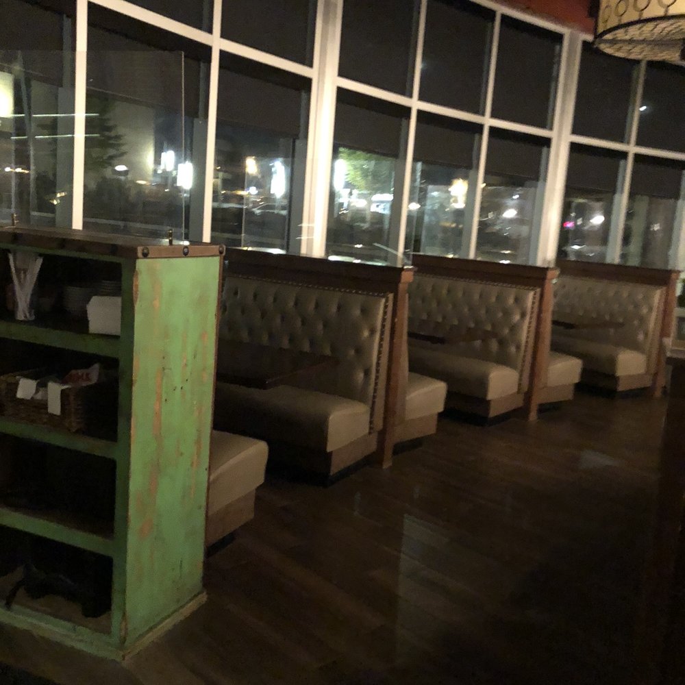 Uncle Julio's - The decor with nice booths and glass to help partition everything safely. - Mexican Near Me - Brentwood, Tennessee