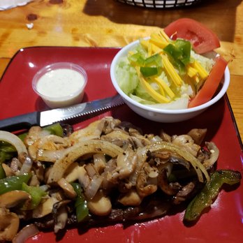 Cornerstone Pub - a plate of food and a bowl of salad - Bars Near Me - Emmetsburg, Iowa