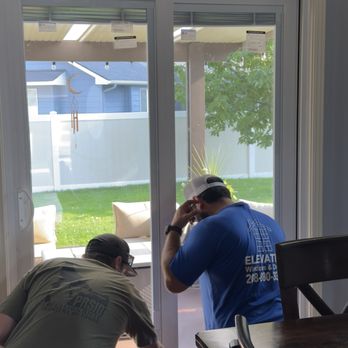 Elevated Windows & Doors - Anthony and Allen installing the patio doors with blinds - Windows Installation Near Me - Garden City, Idaho Elevated Windows & Doors - Anthony and Allen installing the patio doors with blinds - Windows Installation Near Me - Garden City, Idaho