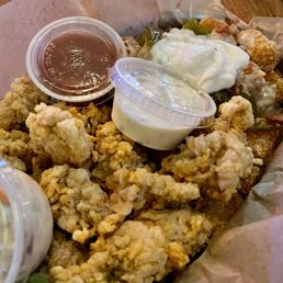 Oyster Dinner with loaded tots (queso, sour cream, bacon and jalapeño