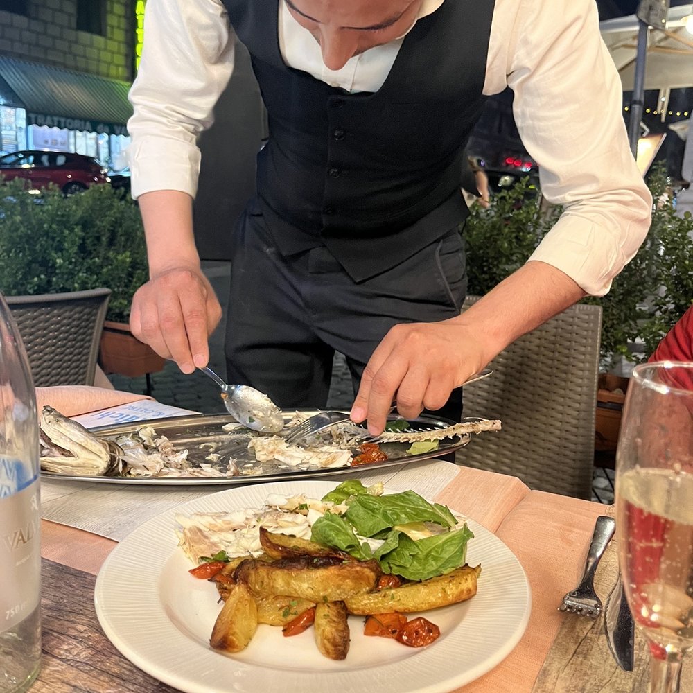 The staff deboning the sea bass  Everyone was  amazing!