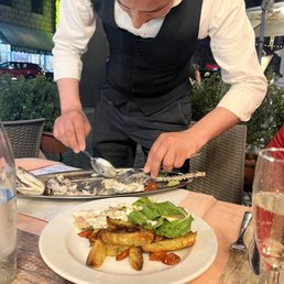 The staff deboning the sea bass  Everyone was  amazing!