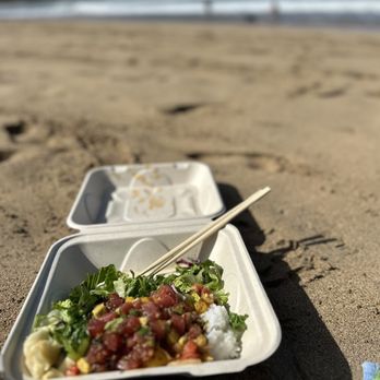 Hanalei Poke - a plastic container with chopsticks on a sandy beach - Food Trucks Near Me - Hanalei, Hawaii Hanalei Poke - a plastic container with chopsticks on a sandy beach - Food Trucks Near Me - Hanalei, Hawaii