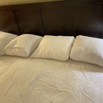 Wingate By Wyndham Peoria - King size bed with small square pillows. - Hotels Near Me - Peoria, Illinois Wingate By Wyndham Peoria - King size bed with small square pillows. - Hotels Near Me - Peoria, Illinois