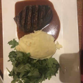 Tommy Bahama - 6oz Filet Mignon with mashed potatoes and arugula. I asked for no blue cheese because I'm not a fan. - Seafood Near Me - Kihei, Hawaii