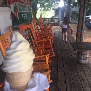 Maxwell Groves Country Store - The orange and vanilla swirled ice cream cone with a view of the porch - Ice Cream & Frozen Yogurt Near Me - Avon Park, Florida Maxwell Groves Country Store - The orange and vanilla swirled ice cream cone with a view of the porch - Ice Cream & Frozen Yogurt Near Me - Avon Park, Florida
