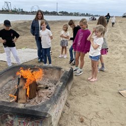 The Treehouse Academy - Survive skills session 2. Students learning to build fires and cook food.