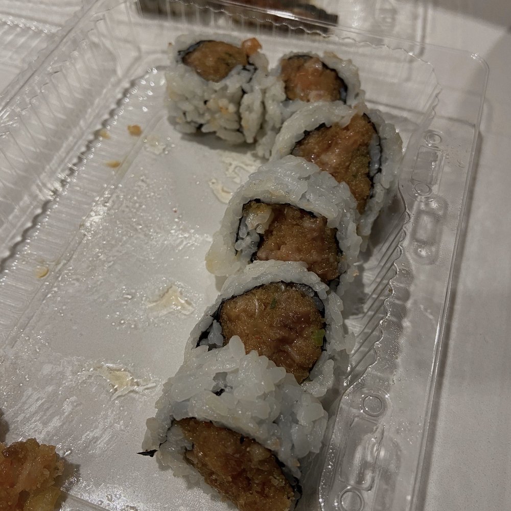 Brown spicy salmon sushi roll Brown spicy salmon sushi roll