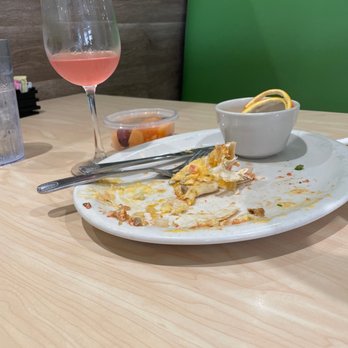 The Toasted Yolk Cafe - Breakfast Burrito with a side of fruit to go and almost gone mimosa. - Sandwiches Near Me - Dothan, Alabama The Toasted Yolk Cafe - Breakfast Burrito with a side of fruit to go and almost gone mimosa. - Sandwiches Near Me - Dothan, Alabama