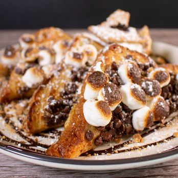 Brekki Brekki - S'mores French Toast: Grilled challah bread topped with marshmallow fluff, chocolate, and graham cracker crumbles. A sweet brunch treat! - Breakfast & Brunch Near Me - Albuquerque, New Mexico