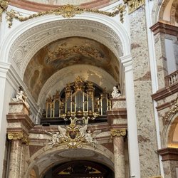 Karlskirche - Ornate gold pipe organ and frescoed gallery