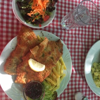 Andy's Krablergarten - Viennese schnitzel aka wienerschnitzel aka veal schnitzel With fries and side salad - German Near Me - Munich, BY Andy's Krablergarten - Viennese schnitzel aka wienerschnitzel aka veal schnitzel With fries and side salad - German Near Me - Munich, BY