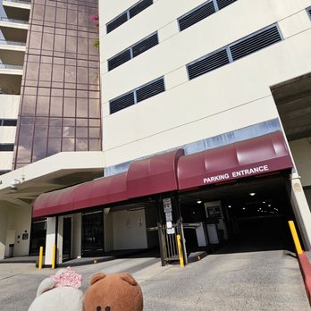 The Imperial Plaza - Entrance to the parking structure... see attendant for parking permit and ticket to validate - Condominiums Near Me - Honolulu, Hawaii