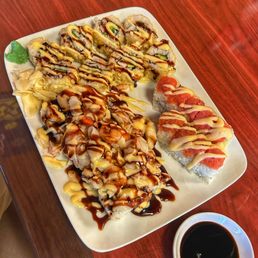 a plate of sushi and a cup of coffee a plate of sushi and a cup of coffee
