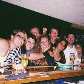 Break Time - a group of people at a bar - Sports Bars Near Me - Goleta, California
