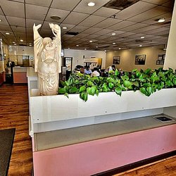 Pho 75 - The view at the front door area. Greetings from Buddha! The cash register is straight ahead on the left.