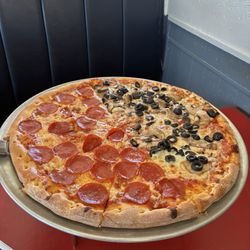 Leo’s Pizzeria - Extra large pizza with half pepperoni and half black olives and mushrooms