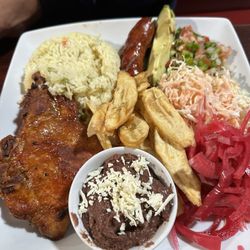 La Casa Vieja - Fried pork chop with sausage, plantains, rice, slaw, pico and pickled onions.