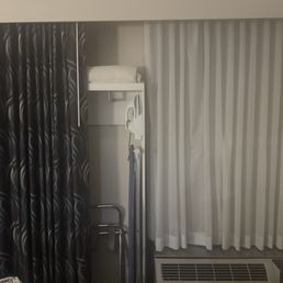 Closet hidden behind curtain. Closet hidden behind curtain.