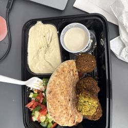 Cafe Yerushalmi - Falafel, fresh salad, hummus, and tahini with pita. Not pictured Moroccan cigars with tahini and pickles.