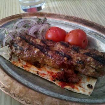 Zaytinya - ADANA KEBAB - skewered ground lamb, house-made harissa,grilled tomatoes, sumac, onions - Greek Near Me - Washington, DC, District of Columbia Zaytinya - ADANA KEBAB - skewered ground lamb, house-made harissa,grilled tomatoes, sumac, onions - Greek Near Me - Washington, DC, District of Columbia
